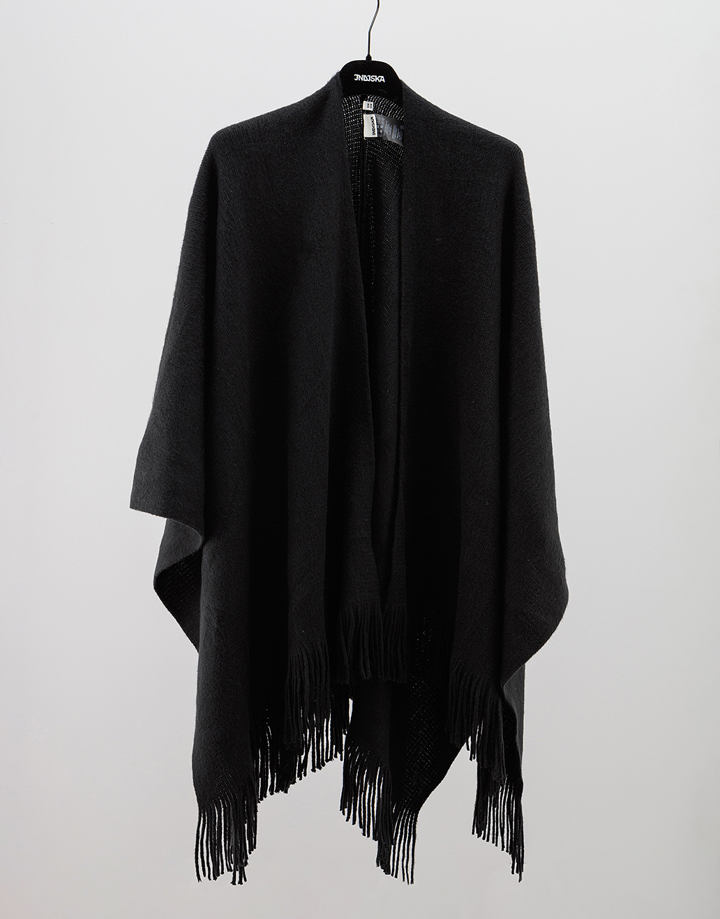 Solid poncho with fringes